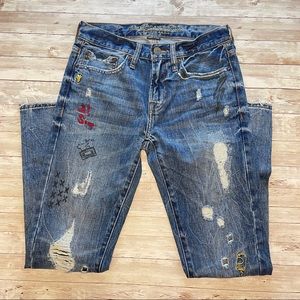 AEO Distressed Embroidered Graffiti Skinny Jeans